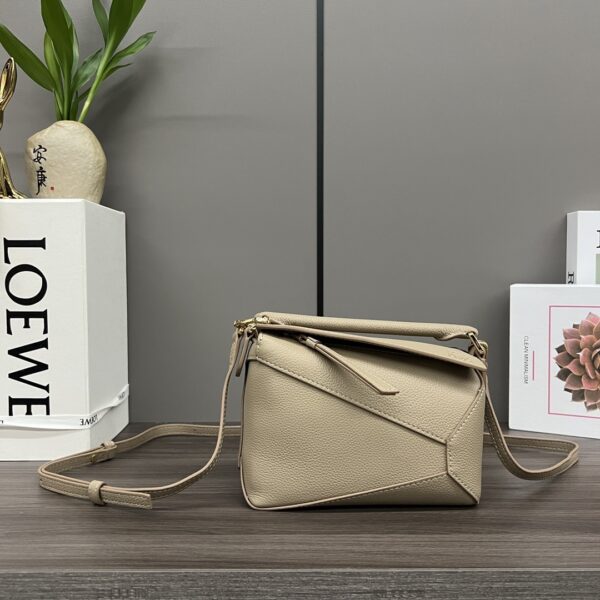 LOEWE's new high quality grain leather Puzzle Edge handbag and clutch pouch