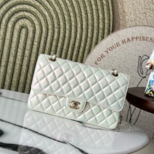 Chane New Iridescent White CF Chain Flap Bag. Classic style with a new iridescent color. Made of imported sheepskin. Twist to open and close. Comes with a sliding chain that allows you to switch between shoulder and crossbody styles at will.